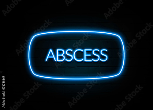 Abscess - colorful Neon Sign on brickwall