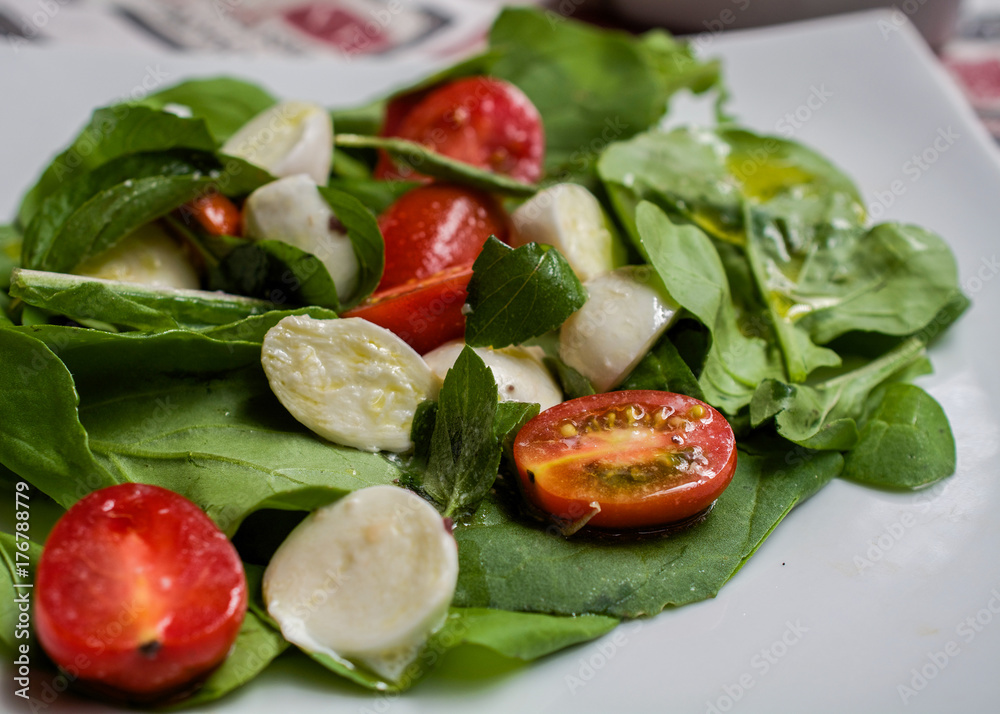 Healthy greens tomato and mozzarella cheese salada Healthy greens tomato and mozzarella cheese salada
