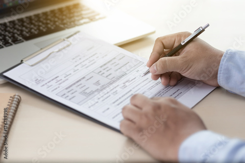 Businessman working reading documents graph financial to job succes Analyze document plans