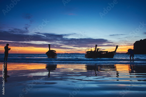 Sunset view from Rilay beach, Thailand to the clouds, and boats silhouette