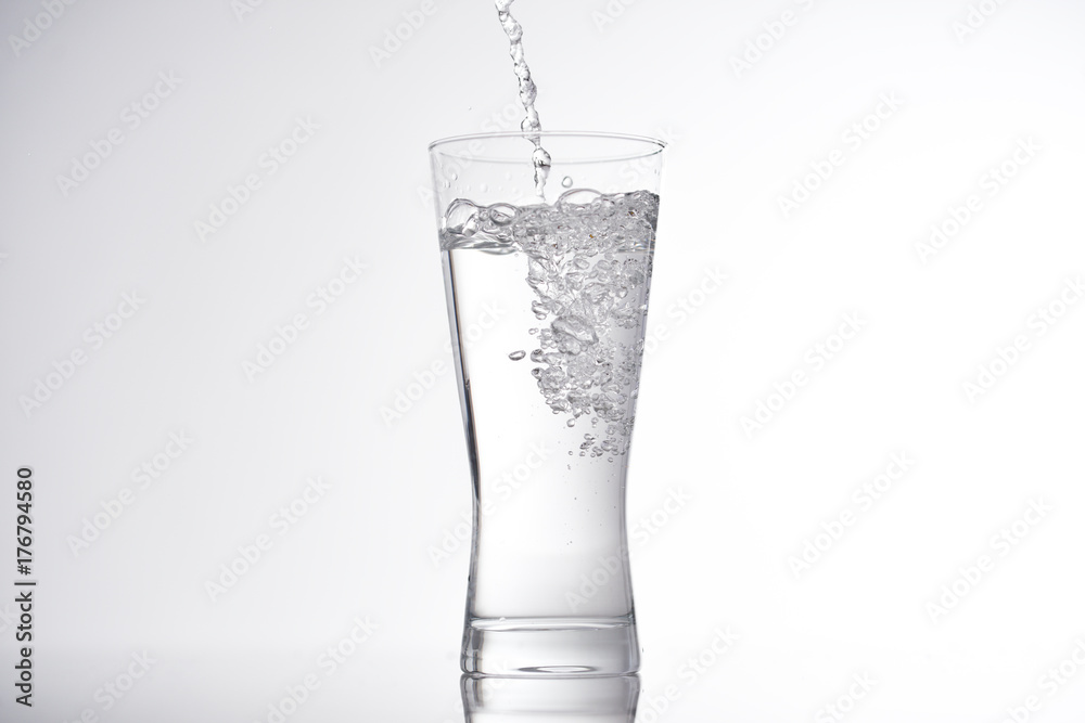 pouring water into glass