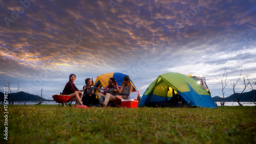 Group of Young Asian Camper Enjoy Camping Outdoors . Holiday   vacation   summer concept .