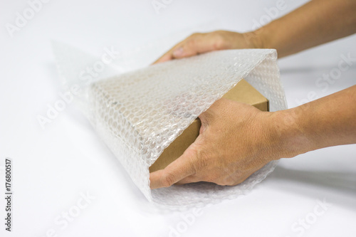 Man hands bubble wrap, covering protection or insurance 