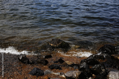 shore of the beach and the river, water and stones