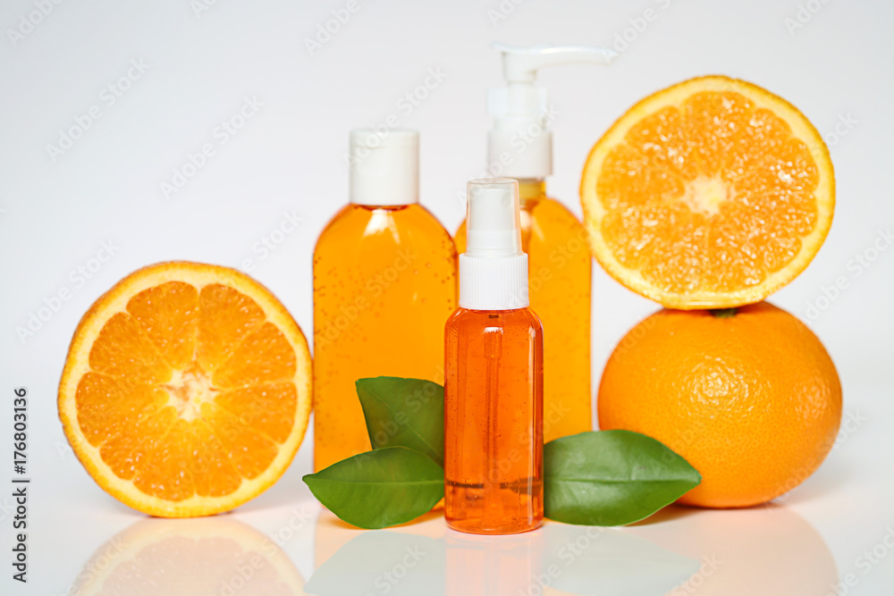Organic Cosmetics with Citrus Fruit Extract. Set for washing with an extract of an orange. orange gel for washing, foam and tonic for the skin and fresh oranges on a light background. Organic Cosmetics with Citrus Fruit Extract. Set for washing with an extract of an orange. orange gel for washing, foam and tonic for the skin and fresh oranges on a light background.