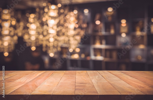 Empty of wood table top with blurred light gold bokeh abstract background.For montage product display or key visual layout