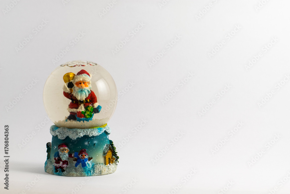 Fototapeta premium winter santa trinket snow globe