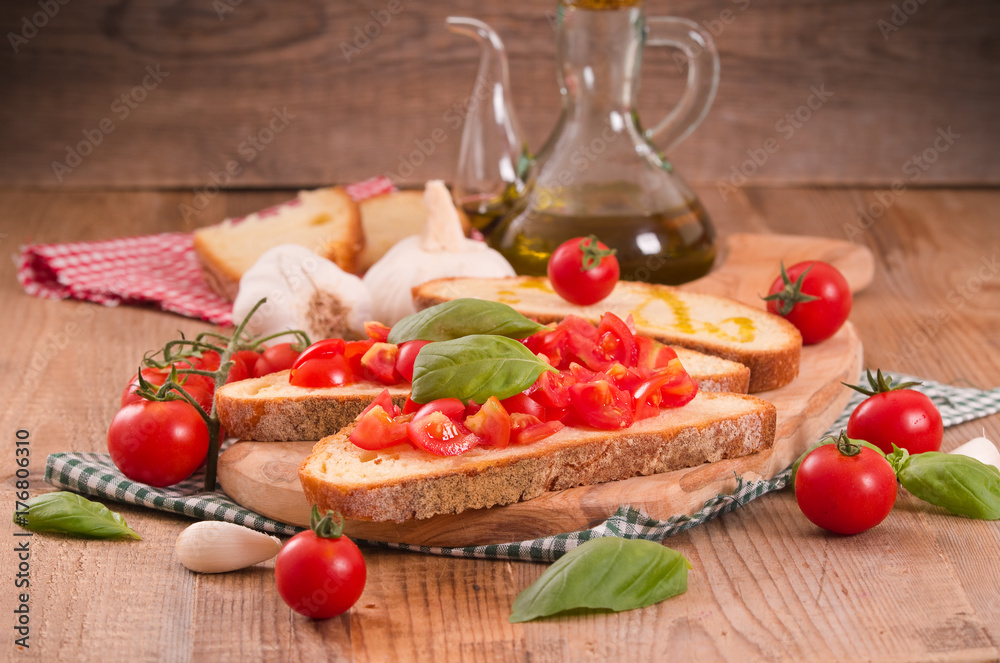 Bruschetta bread with basil and chopped tomatoes.