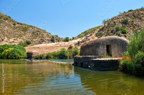 Old traditional watermills in the Guadiana river at Azenhas. Mertola. Portugal