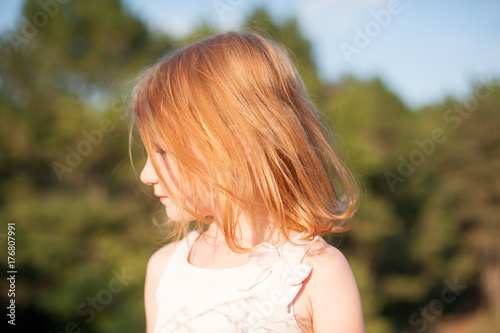 Beautiful red-haired girl in profile