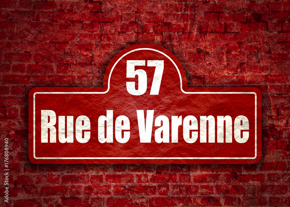Obraz premium Street signs with an inscription in French Varenne street, the building number fifty seven Paris, France. Ancient brick wall grunge texture