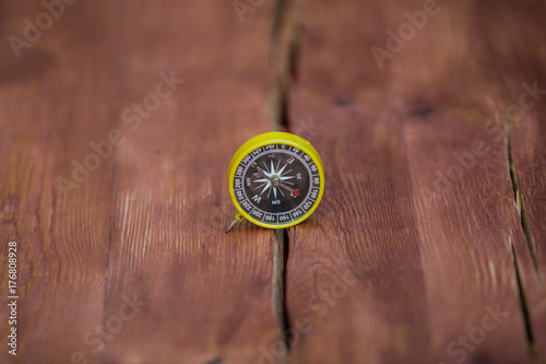 compass on an old wooden table