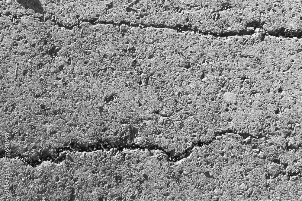 background and texture of a concrete wall with cracks