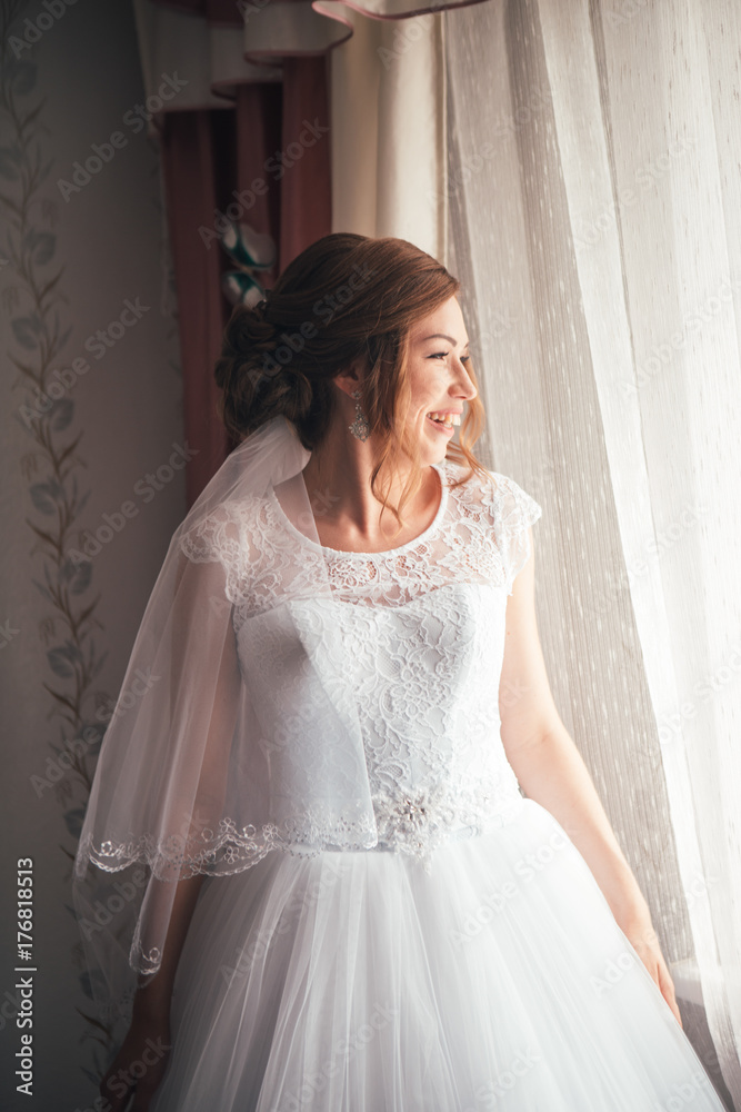 portrait of a young bride on a light background portrait of a young bride on a light background