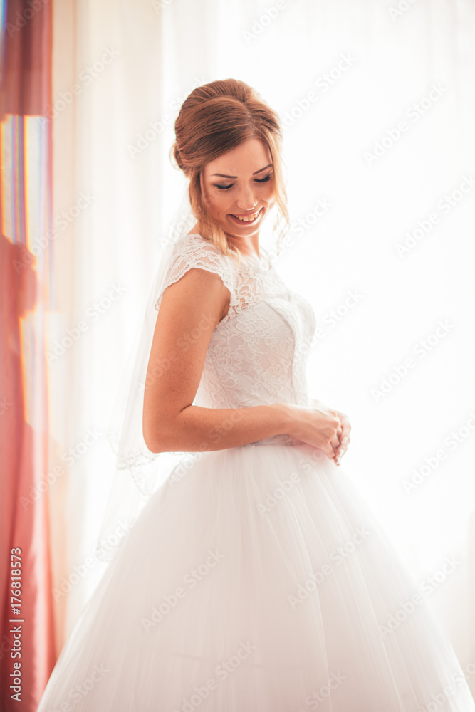 portrait of a young bride on a light background portrait of a young bride on a light background