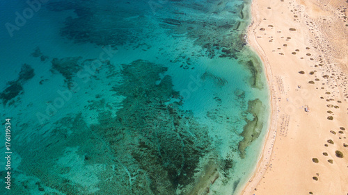 aerial view of beach with coral reef