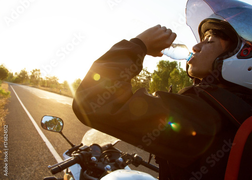 Driver Motorcycle drink water 