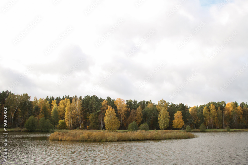 Countryside view of small river pond near small city in autumn, Latvia. Countryside view of small river pond near small city in autumn, Latvia.