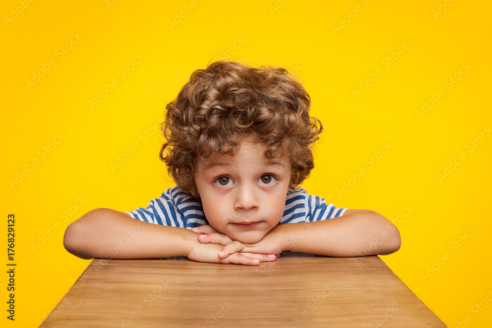 Little boy looking dreamily at camera Little boy looking dreamily at camera