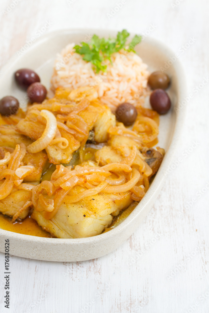 fried codfish with boiled rice and olive oil on dish fried codfish with boiled rice and olive oil on dish