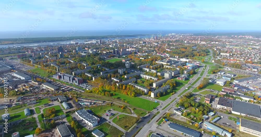 KLAIPEDA, LITHUANIA - OCTOBER 15, 2017: AERIAL. Smooth drone flight through Klaipeda City at high altitude