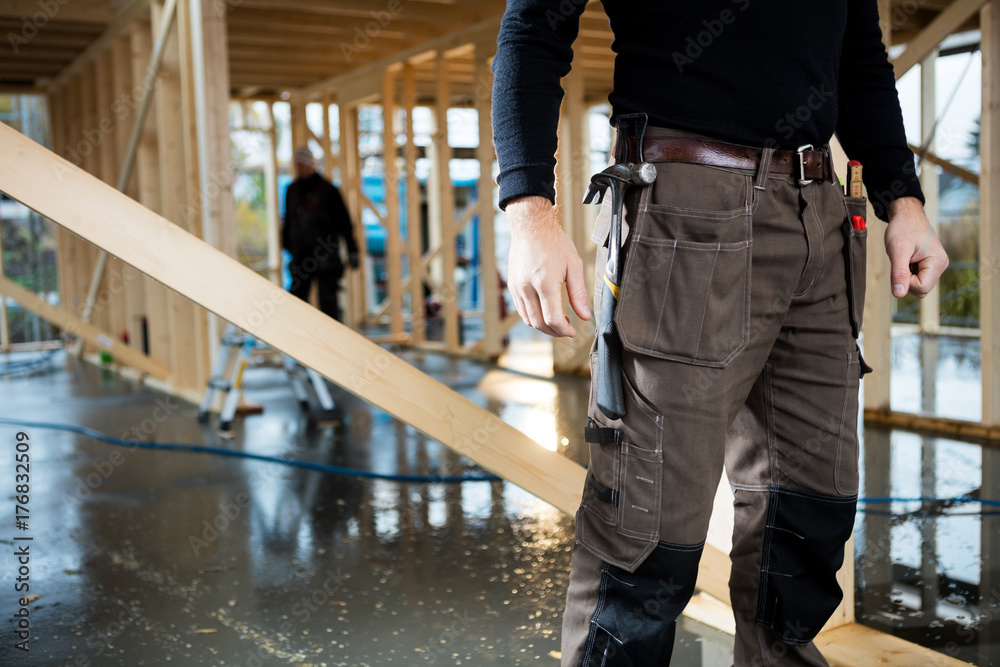 Midsection Of Carpenter Standing At Site