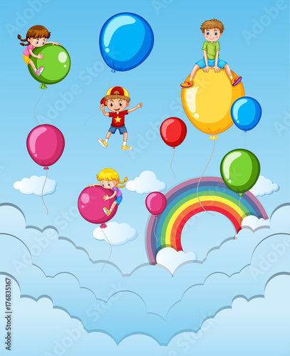 Happy children on colorful balloons in the sky