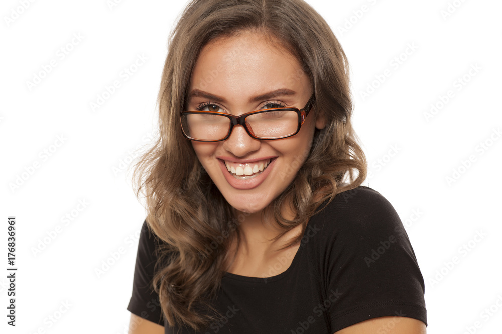 Portrait of beautiful young happy woman on white background