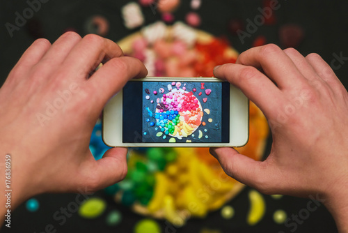 Making photo of colorful candies on smartphone