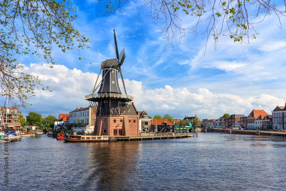 Picturesque landscape with a windmill of the Dutch city of Haarlem.