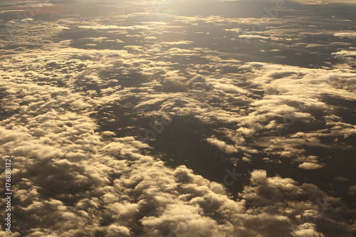 Sunset White Cloud sky at high level attitude, view from window airplane