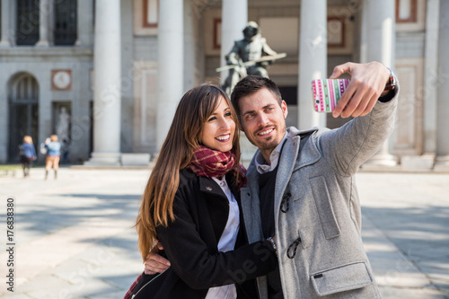 couple taking selfie at prado museum madrid