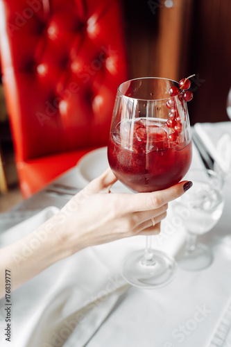 red cocktail with cranberries photo