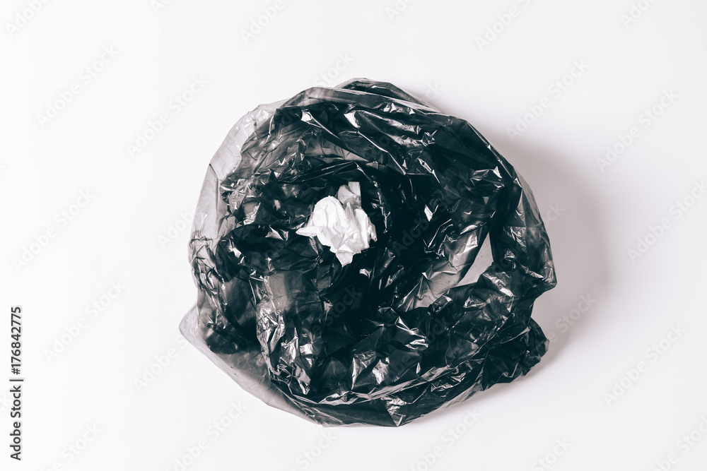 Black garbage bag with thrown napkin