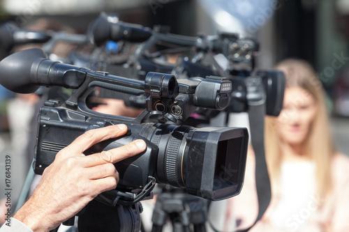 News conference. Filming an event with a video camera.