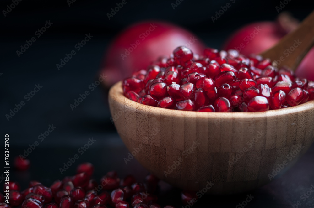 fresh pomegranate on a black background fresh pomegranate on a black background