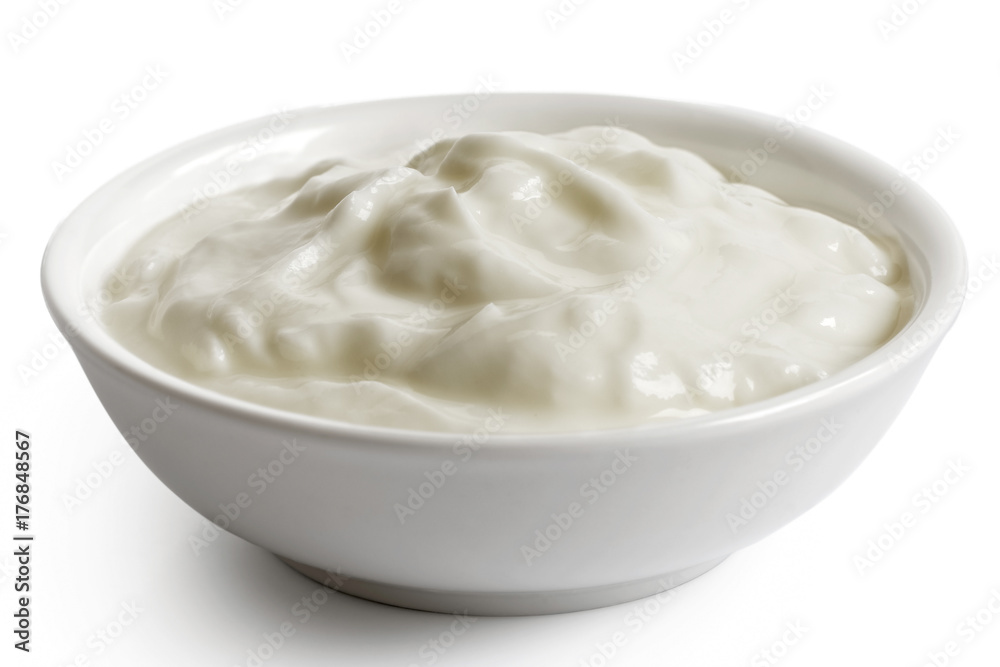 White ceramic bowl of skyr yoghurt isolated on white. White ceramic bowl of skyr yoghurt isolated on white.