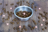 dry dog food in bowl and vitamins for healthy  dog treats 