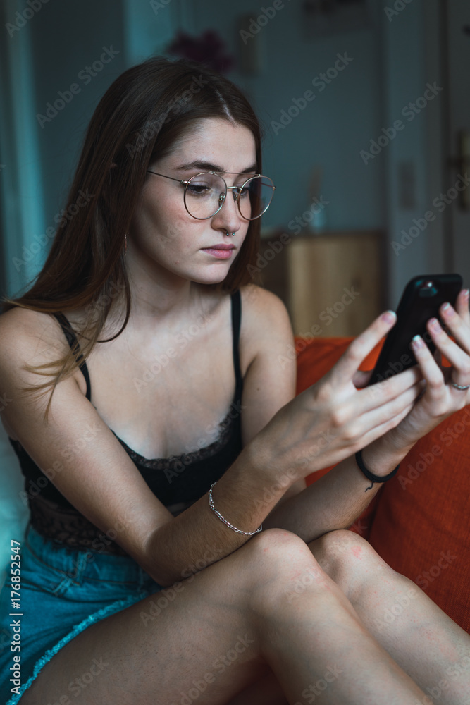Stylish girl with phone at home Stylish girl with phone at home