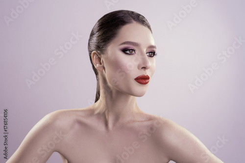 beautiful portrait with red lips in the studio. fresh clean skin. high qauality image.