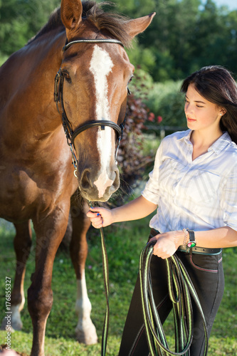 young girl with her horse poseing together