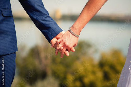 hand wedding couple on the background of nature