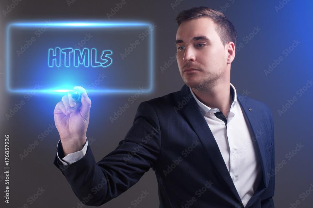 The concept of business, technology, the Internet and the network. Young businessman showing inscription: HTML5 The concept of business, technology, the Internet and the network. Young businessman showing inscription: HTML5
