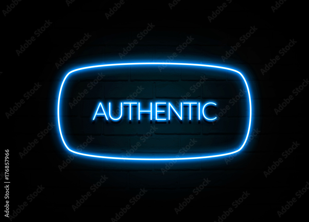 Authentic - colorful Neon Sign on brickwall Authentic - colorful Neon Sign on brickwall
