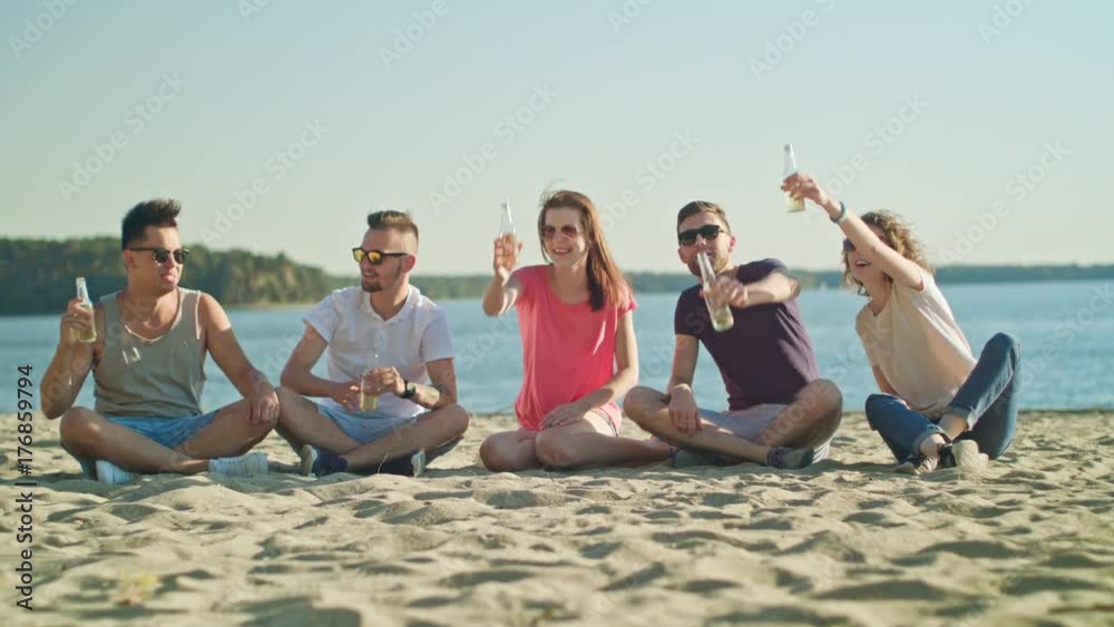 Young people having fun on the beach. Long shot. Soft Focus. Young people having fun on the beach. Long shot. Soft Focus.