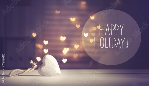 Happy Holiday message with a white heart with heart shaped lights