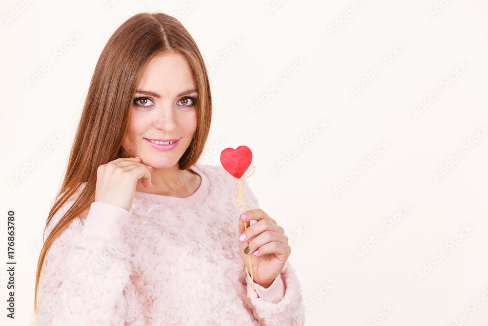 Beautiful woman holding heart shaped hand stick Beautiful woman holding heart shaped hand stick