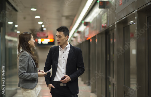 Couple having conversation at train station