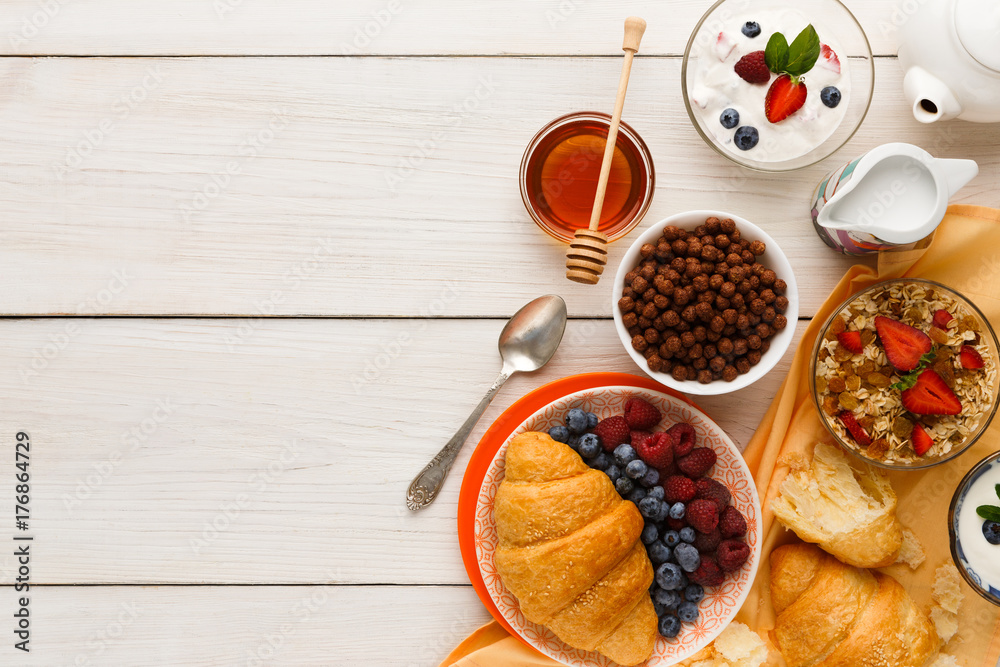 Rich breakfast menu on wooden table, copy space Rich breakfast menu on wooden table, copy space
