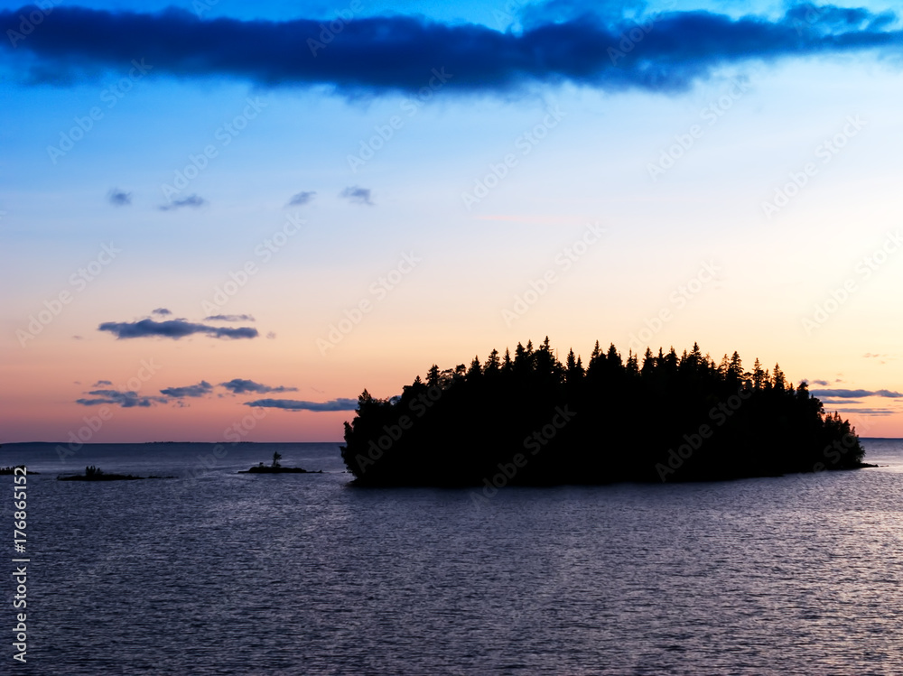 Ladoga lake, summer sunset. Dramatic clouds at sunset.